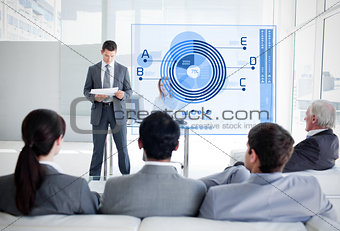 Business people listening and looking at blue diagram interface