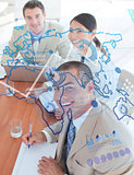Overview of cheerful colleagues looking at blue map interface