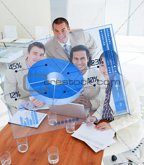 Overview of happy colleagues looking at blue chart interface