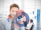 Businessman looking at blue diagram interface