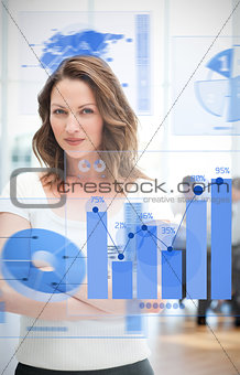 Confident blonde businesswoman using chart interfaces