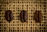 Three coffee beans in a row