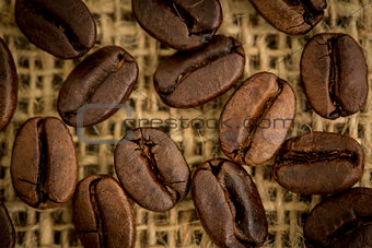 Coffee beans resting on sack