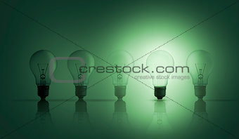 Light bulbs in a row with one lit up