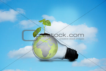 Light bulb with plant and earth