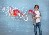Student posing in front of chalk board