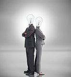 Business people with light bulbs instead of heads