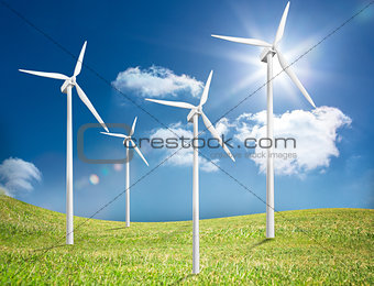 Four wind turbines in a field