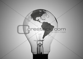 Light bulb with map of earth on its surface