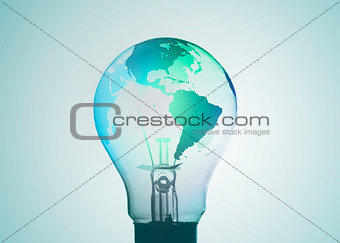 Light bulb with map of earth on its surface in blue and green