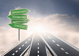 Road over clouds with business terms on signposts