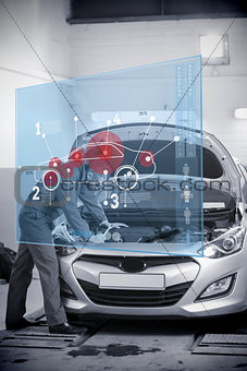 Mechanic with open hood with futuristic interface in black and white