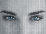 Attractive blue eyed woman with binary code on face