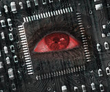 Red eye in middle of black circuit board