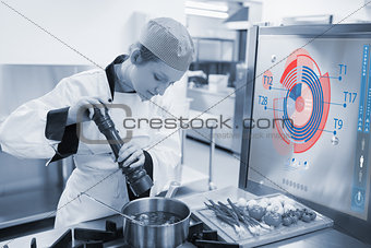 Chef cooking for a restaurant with futuristic interface