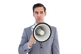 Business preparing himself to shout with a megaphone
