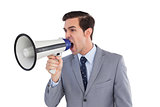 Businessman yelling into a megaphone