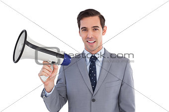 Smiling businessman holding a megaphone