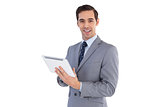 Happy businessman holding a tablet pc