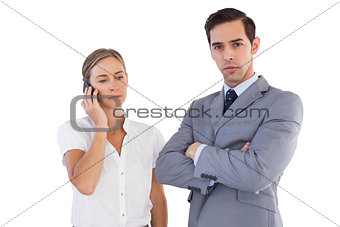 Businesswoman on the phone next to her colleague