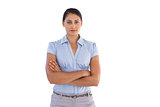 Young businesswoman standing alone with her arms crossed