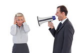 Businessman shouting at colleague with his bullhorn