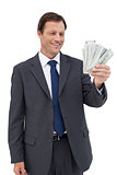 Smiling businessman holding bills