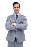 Cheerful businessman with arms folded