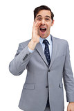 Young businessman shouting at the camera