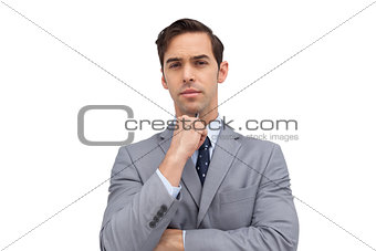 Doubtful businessman looking at camera