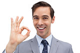 Successful businessman giving ok sign