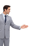 Young businessman giving his hand
