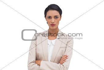 Serious businesswoman with arms crossed