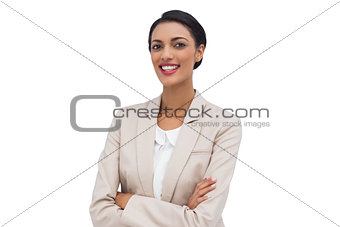 Cheerful businesswoman with arms crossed