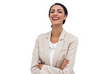 Happy businesswoman with arms crossed