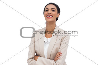 Happy businesswoman with arms crossed
