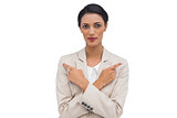 Charismatic businesswoman with her arms crossed and fingers pointing