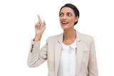 Businesswoman showing something with her finger