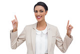 Smiling businesswoman with hands up