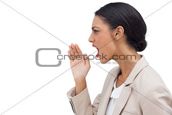 Profile view of a businesswoman calling for someone