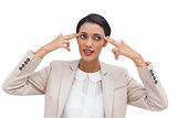 Confident businesswoman pointing her head with her fingers