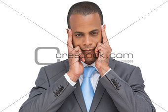 Businessman putting his fingers on his temples