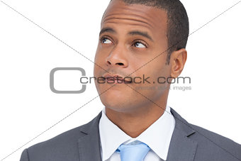 Thoughtful businessman standing