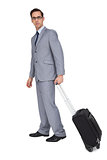 Businessman with glasses holding a trolley