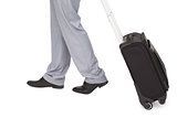Businessman legs walking with a suitcase