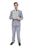 Smiling businessman holding a clipboard