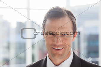 Close up of confident businessman standing