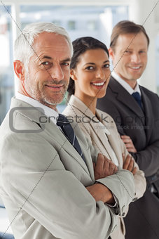 Cheerful business people looking in the same way