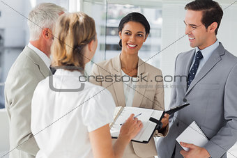Cheerful business people making an appointment