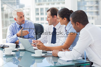 Group of business people brainstorming together